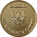 Złoty medal z orłem, inskrypcja "ZA ZASŁUGI DLA WOJDAWÓDZTWA ŚWIĘTOKRZYSKIEGO".